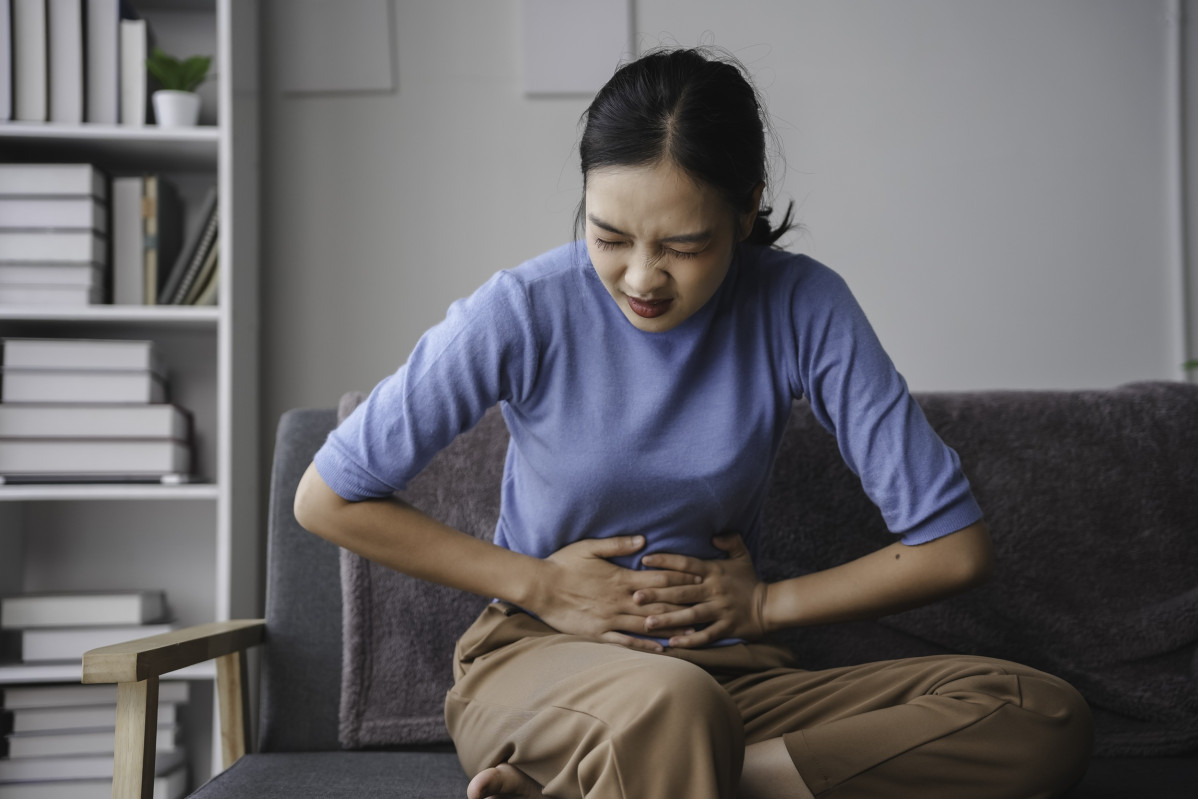 Young woman is experiencing intense abdominal pain 2024 12 27 17 16 46 utc